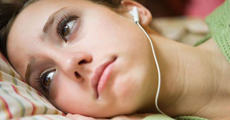 Sad girl listening to songs