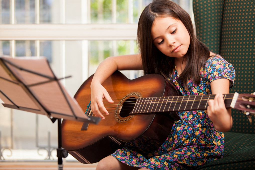 child-learning-guitar-chords-1024x683