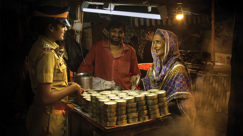 Police woman buying tea