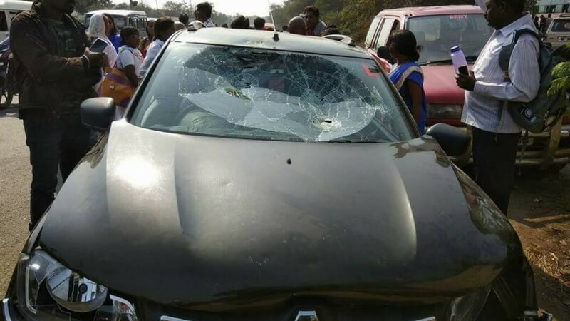 Broken car windshield in Koregaon