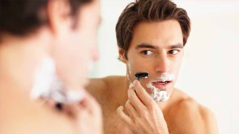 Guy Shaving With Razors