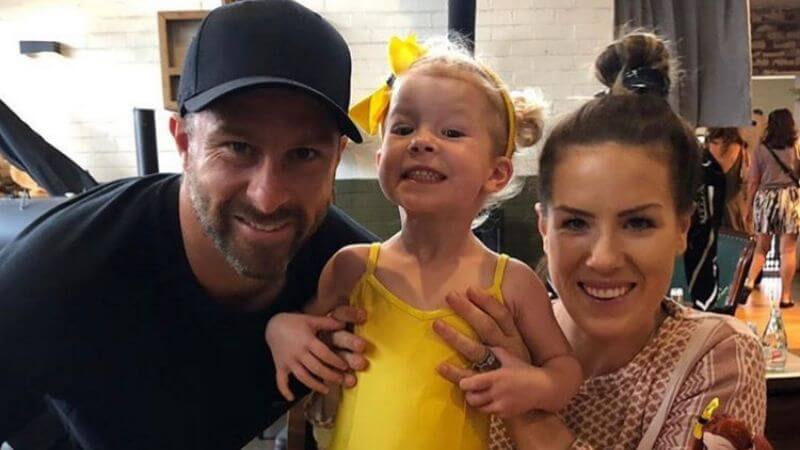 Matthew Wade with wife and daughter