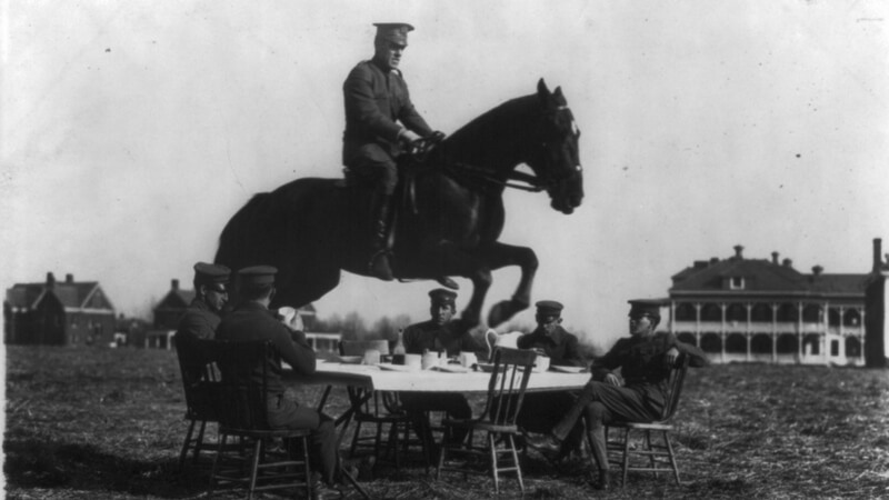 Army stunt jump in horse over dining table