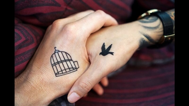 cagged bird tattoo