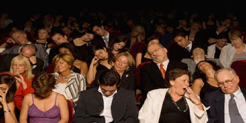 Sleepy people at the theatre