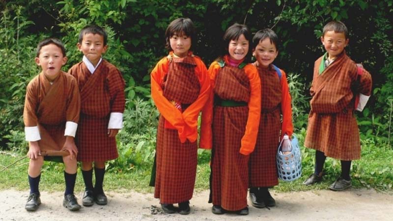 students wear a traditional national costume is Bhutan